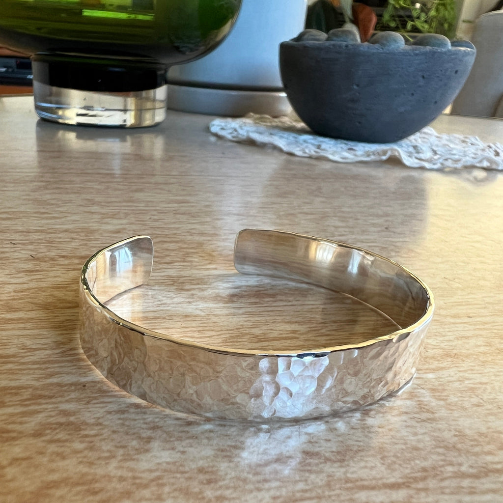 Silver bracelet on a wooden surface