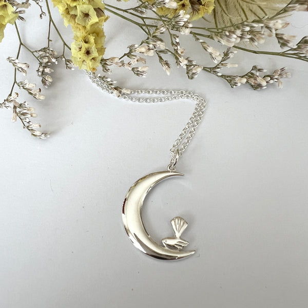 Petite Pīwakawaka Moon Necklace – Sterling Silver Fantail on Crescent Moon