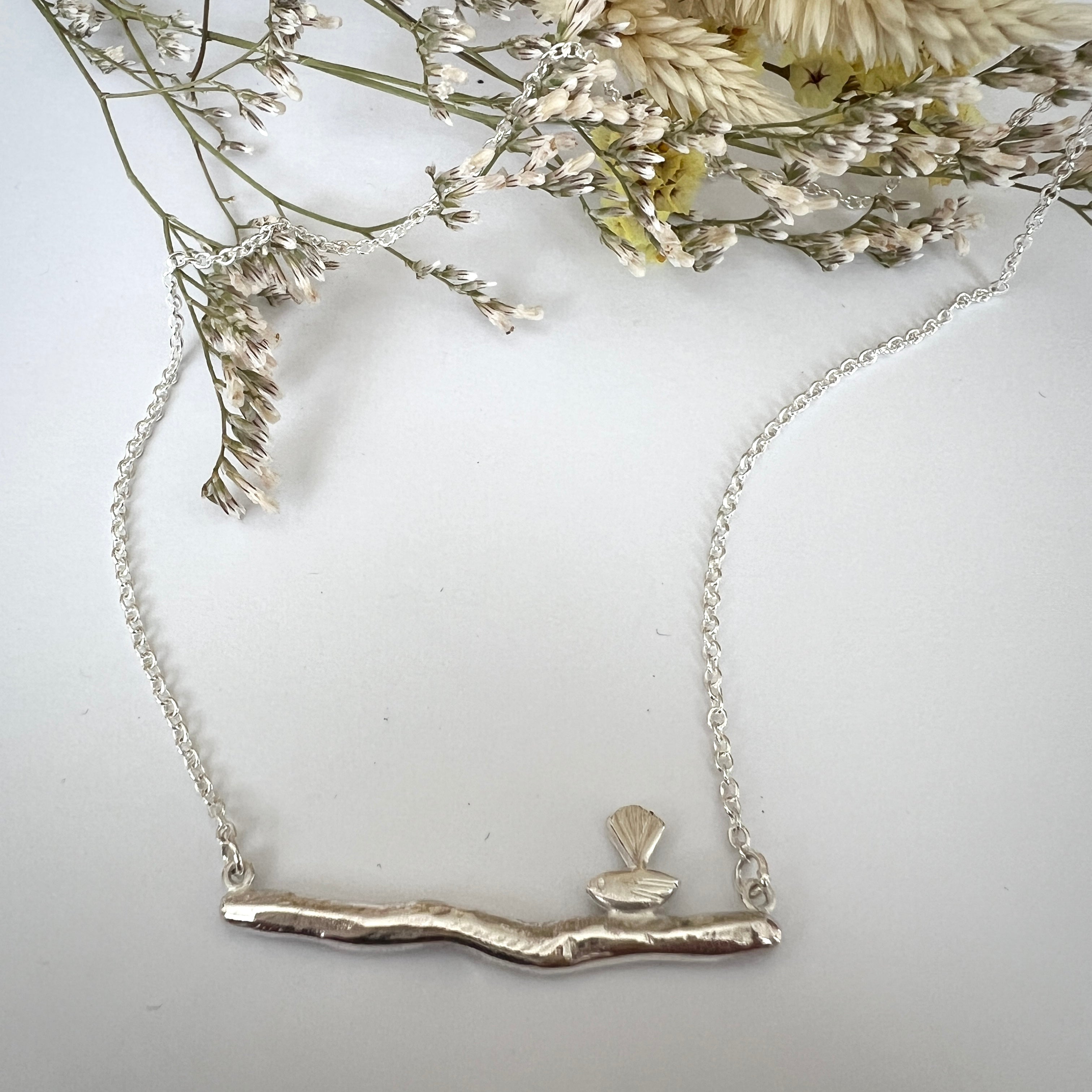 Charming Pīwakawaka Silver Necklace – Petite Bird on Branch Design