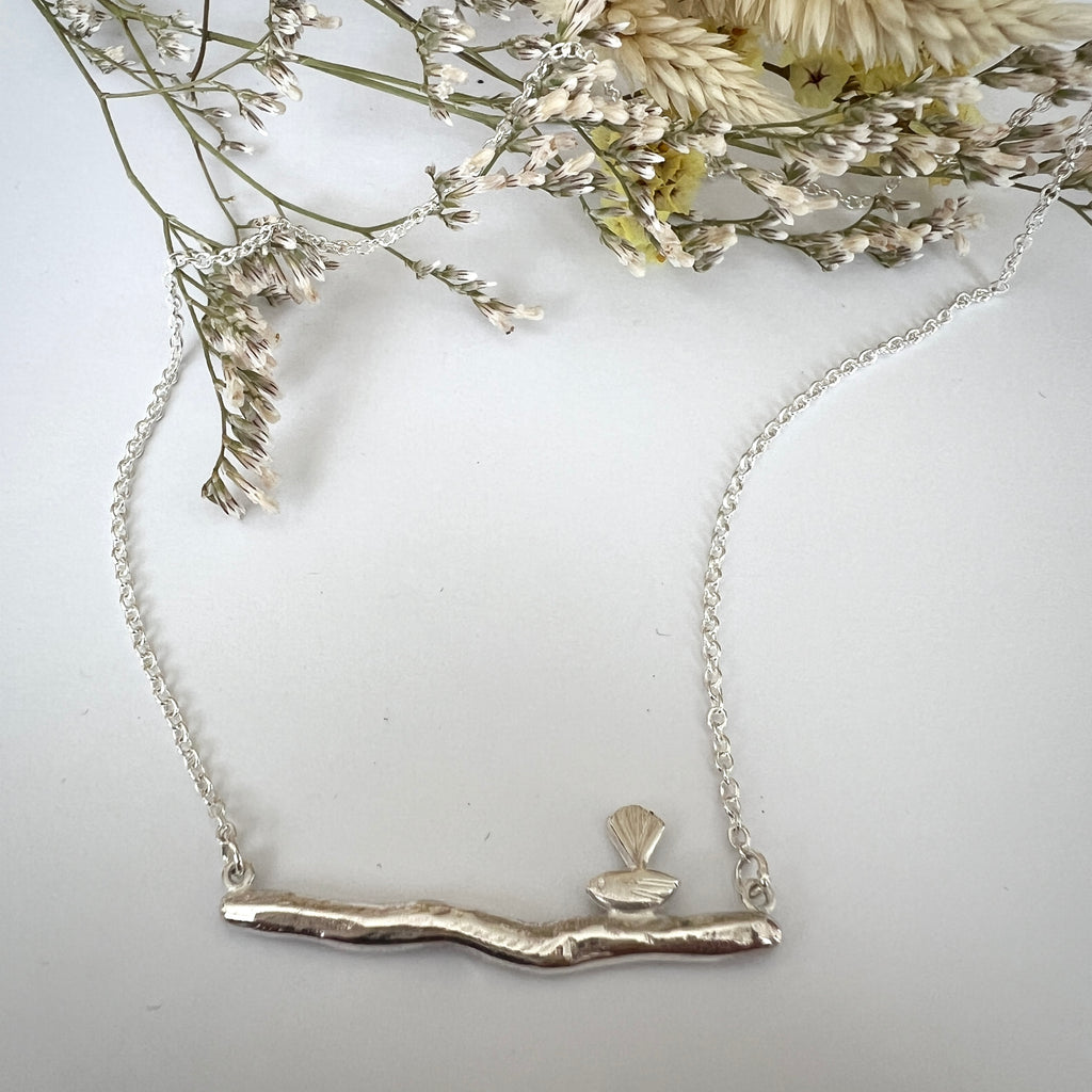 Silver bird on a branch necklace