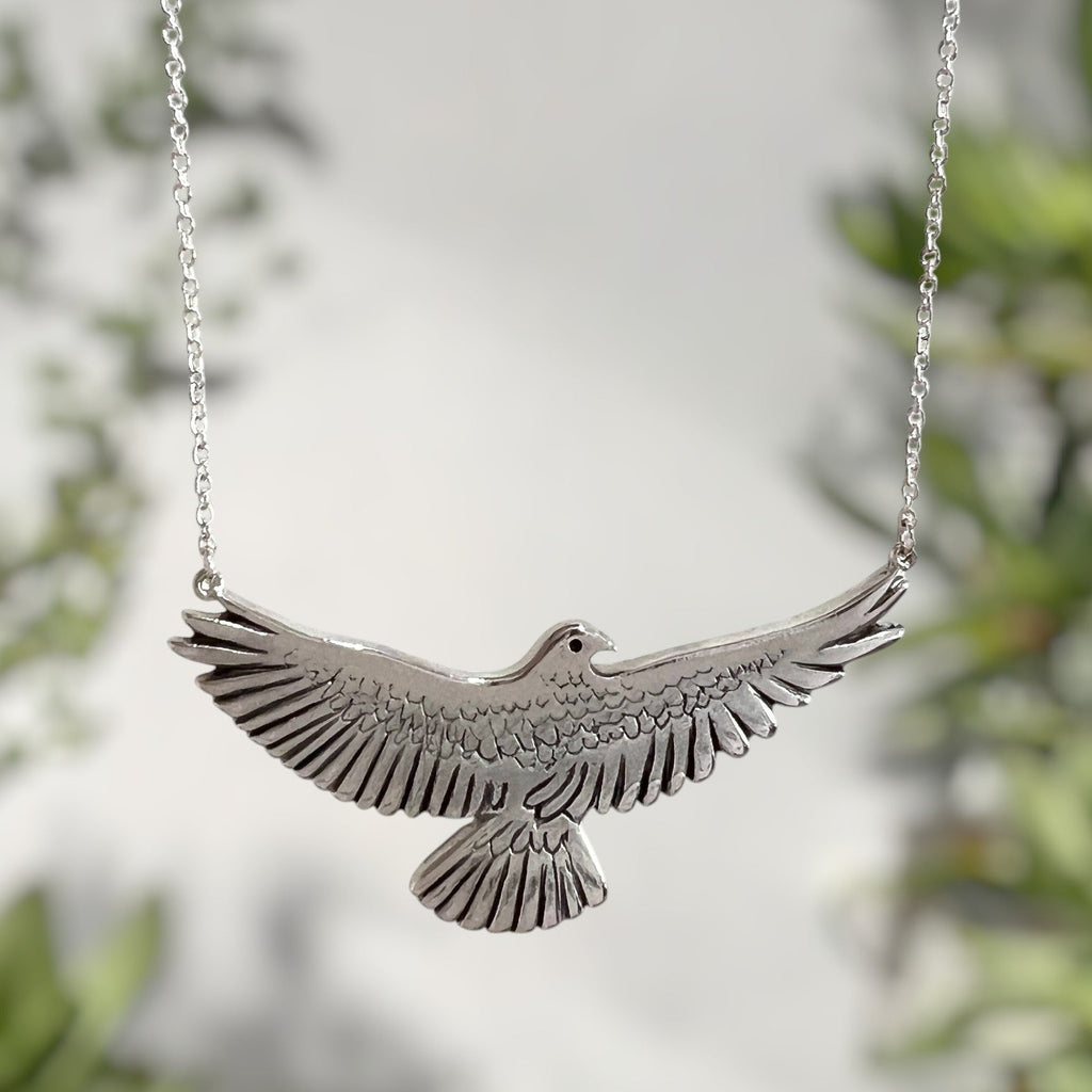 SilverKea pendant necklace against a blurred natural background