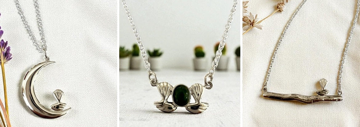 Three silver necklaces with unique designs on a white background