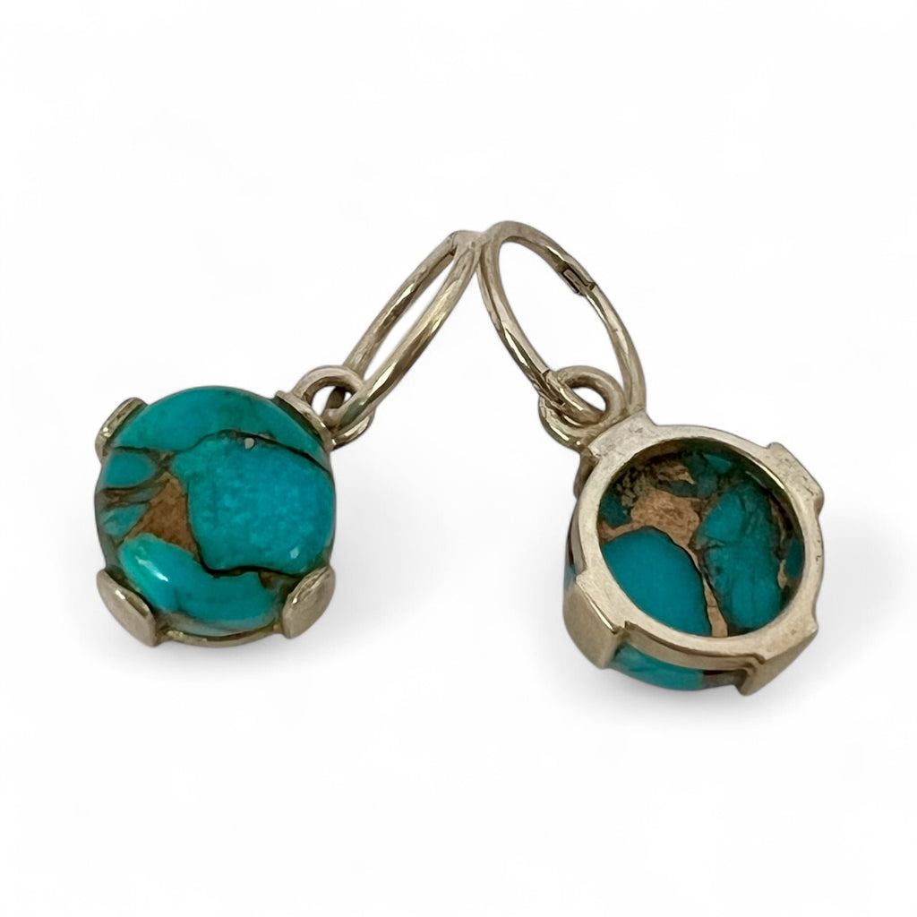 Turquoise stone earrings with silver setting on a white background
