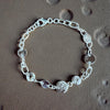 Silver bracelet on a textured surface