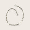 Silver chain bracelet on a light beige background