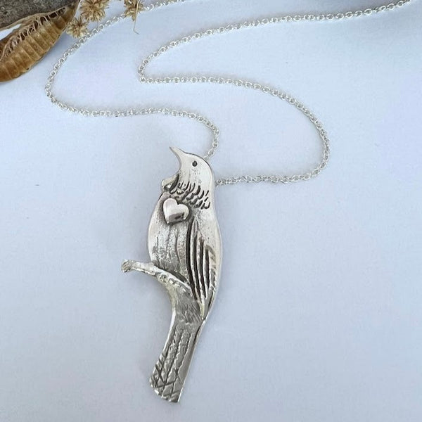 Handsome Tui with heart necklace, sterling silver