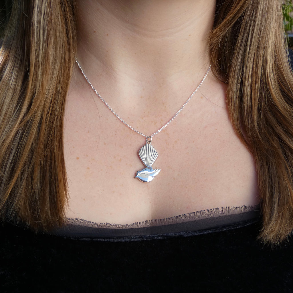 Silver stylised Fantail (Piwakawaka) pendant, profile of bird on 45cm silver chain, hand finished from casting by Tania Mallow Jewellery
