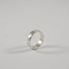 Silver ring, flat profile, hammered finish, 5 mm wide, handmade by Tania Mallow Jewellery