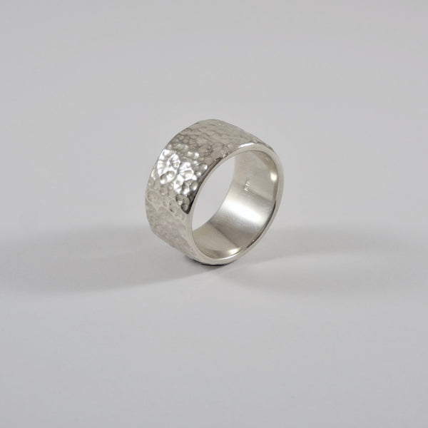 Silver ring 11mm wide with dimpled texture, handmade by Tania Mallow Jewellery