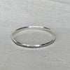 Solid sterling silver bangle with lace texture finish, 5mm wide, handmade by Tania Mallow Jewellery